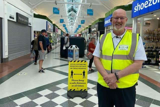 Steve Andrews, manager at the Hildreds Centre, was helping customers get used to the new social distancing signage.