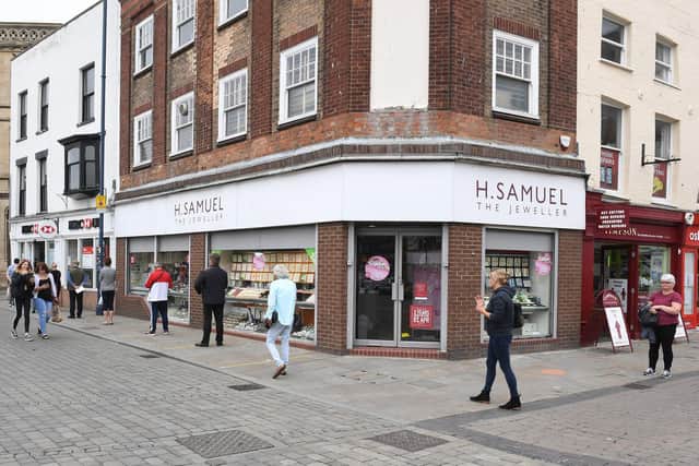 Queueing to get into shops