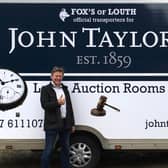 Auctioneer James Laverack with the new auction room transport.