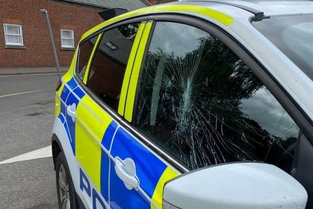 The damaged police car after the alleged assault in Sleaford. EMN-200621-095337001