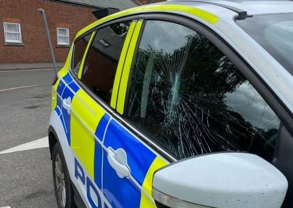 The damaged police car after the alleged assault in Sleaford. EMN-200621-095337001