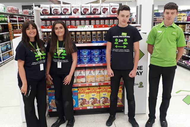 What a co-twin-cidence! Lauren (left) and Charlotte Whisker and Jay (left) and Callum Troop, all of Asda, in Boston.