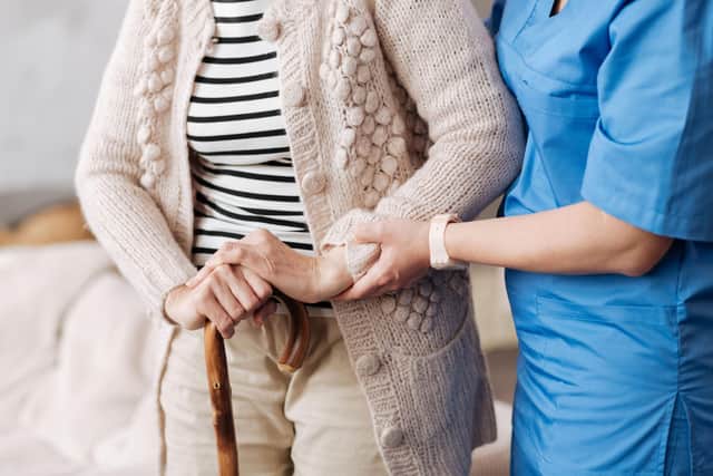 Care - Elderly patient aided by nurse PPP-191219-122759003