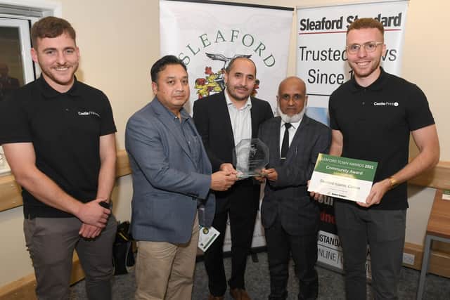 Sleaford Islamic Society receive the Community Award from sponsors Castle Print. EMN-211015-095552001