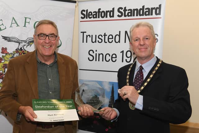 Mark Bamford is Sleafordian of the Year, with Mayor of Sleaford, Coun Robert Oates. EMN-211015-095257001