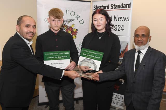 Keira and Cain Dodsworth win Care of the Year Award, presented by sponsors Sleaford Islamic Society. EMN-211015-095528001
