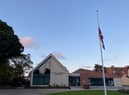 The Union Flag flying half-mast on Skegness' new flag pole in Tower Gardens.