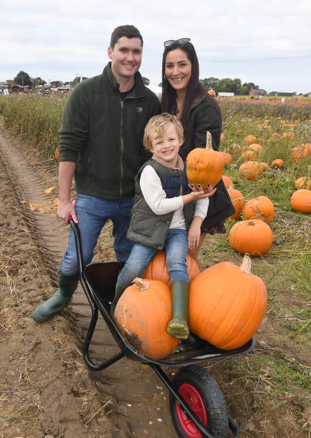 Kate Tait and Adam Carter of Sleaford with Jack Tait, four. EMN-211018-103743001