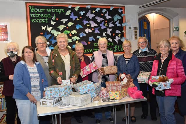 Filling shoe boxes at All Saints Church in Wragby. Photo John Edwards EMN-211018-104819001