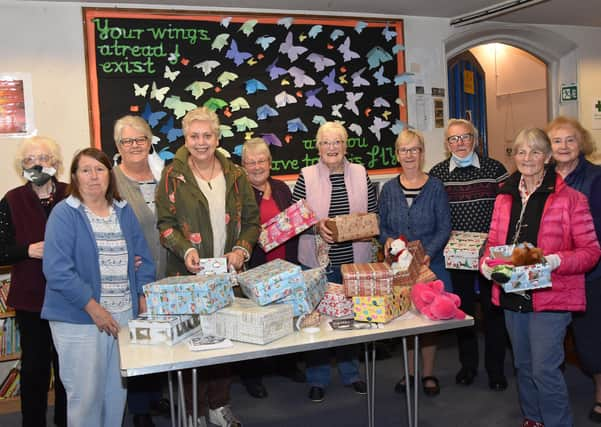 Filling shoe boxes at All Saints Church in Wragby. Photo John Edwards EMN-211018-104819001