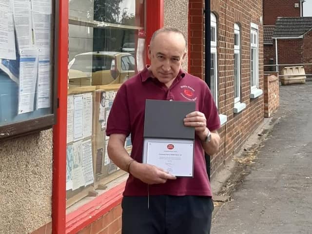 Andy Blagojevitch, Postmaster for Middle Rasen Post Office, has been presented with a 30 Years Long Service award for his devoted service to the community. EMN-211015-100249001
