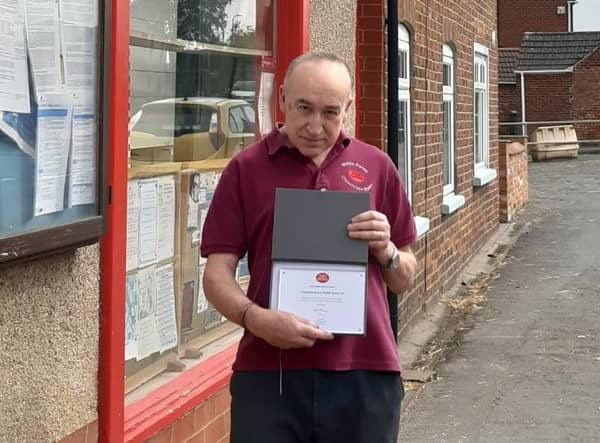 Andy Blagojevitch, Postmaster for Middle Rasen Post Office, has been presented with a 30 Years Long Service award for his devoted service to the community. EMN-211015-100249001