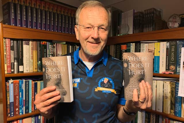 Boston author Tim Atkinson with his new book ‘Where Does It Hurt?’.