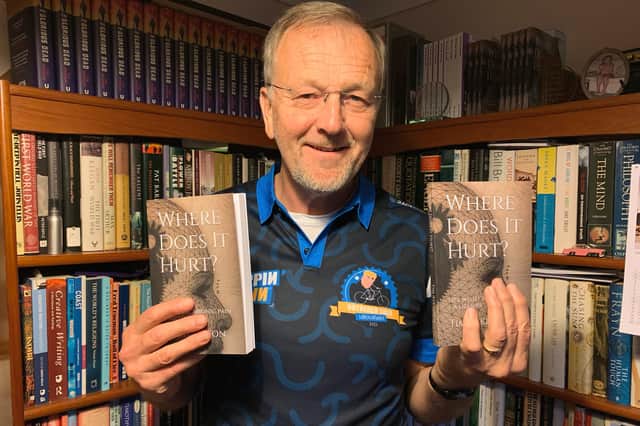 Boston author Tim Atkinson with his new book ‘Where Does It Hurt?’.