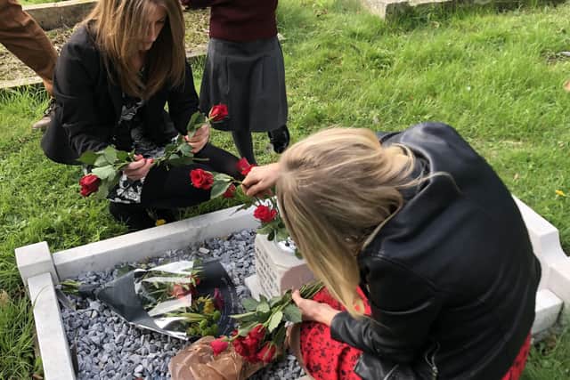 Alvey pupils laying flowers during Brian Fowler's memorial serrvice. EMN-211020-172700001