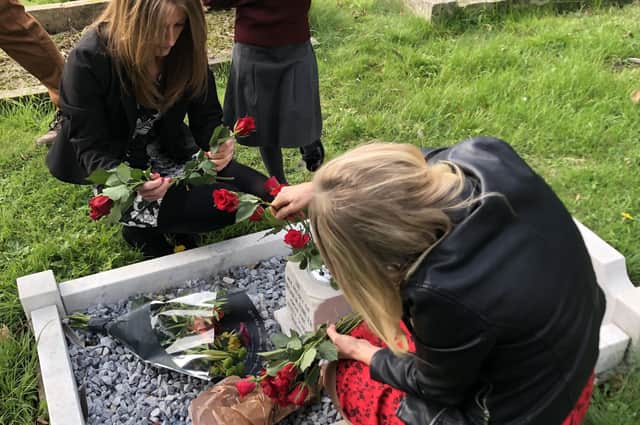 Alvey pupils laying flowers during Brian Fowler's memorial serrvice. EMN-211020-172700001