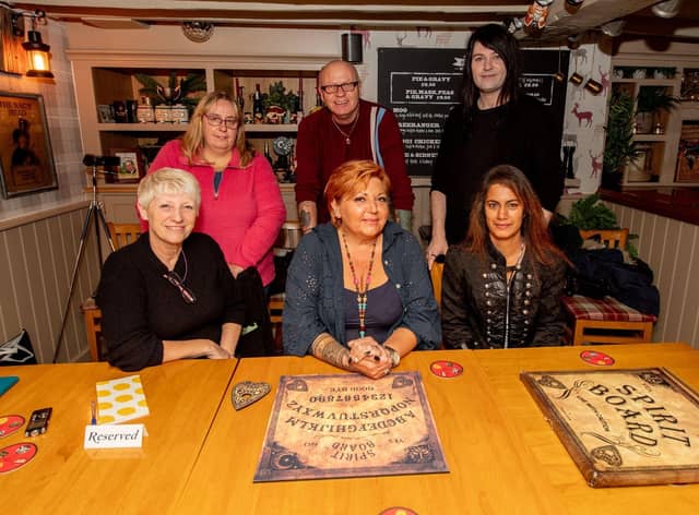 The guests get ready for a paranormal investigation at the Thatch pub. EMN-211021-122655001