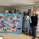 Horncastle History & Heritage Society archivist Mary Silverton and chairman Ian Marshman receive the special set of scrubs for the Town Archive from Tracey Leyland and Shelley Wills from Horncastle & District Scrubs. EMN-211025-112858001