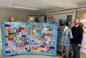 Horncastle History & Heritage Society archivist Mary Silverton and chairman Ian Marshman receive the special set of scrubs for the Town Archive from Tracey Leyland and Shelley Wills from Horncastle & District Scrubs. EMN-211025-112858001