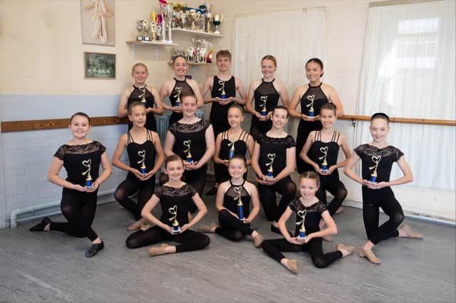 The Top Achiever trophy recipients.