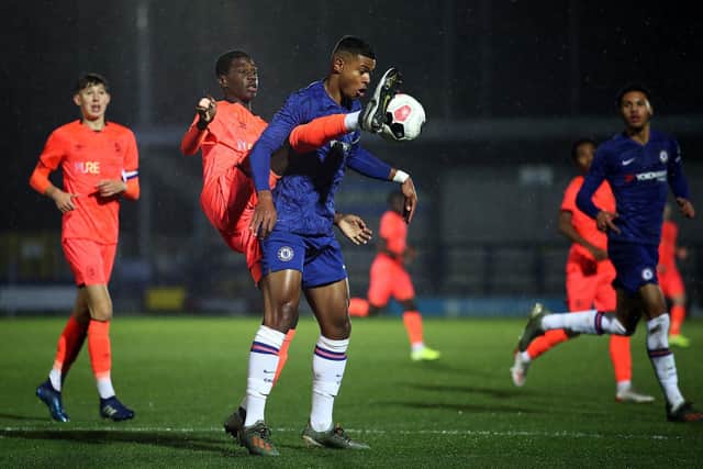 Loick Ayina reaches around for the ball in a contest against Chelsea. Photo: Getty Images