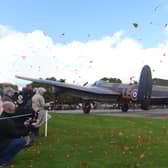 Petals dancing in the breeze after being released from the Just Jane Lancaster at the Lincolnshire Aviation Centre in East Kirkby.