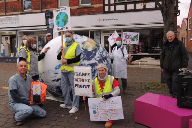 Sleaford Climate Action Network members stage their climate emergency performance near Handley Monument. EMN-210611-180252001