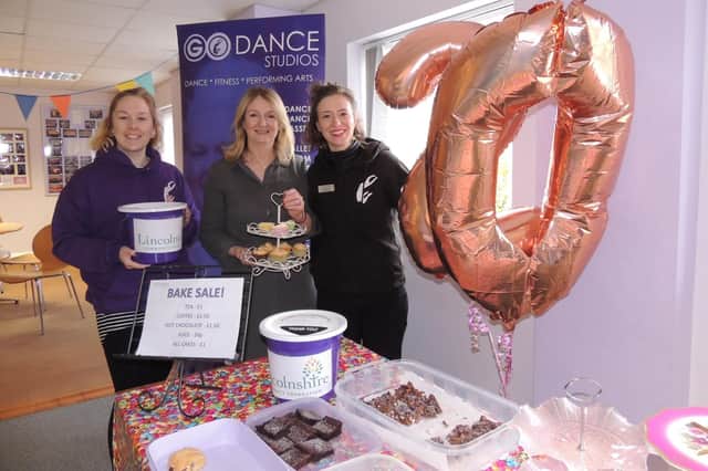 Celebrating 20 years in the community withe a bake sale for Lincolnshire Community Foundation, from left - Go Dance manager Jade Mountain, principal Michelle Cooper and assistant principal Harriet Spence. EMN-210611-180201001