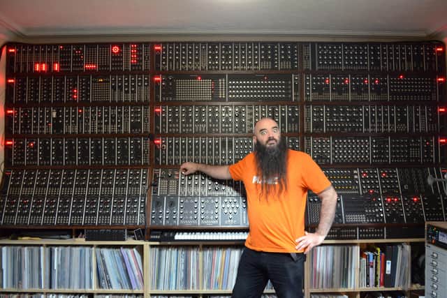 David Cranmer with the giant modular synthesiser he built in his house.