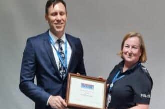 Sgt Kate Odlin receiving her award.