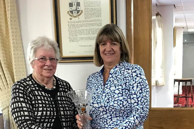 Stoke Rochford's Pam Watson receives her trophy from mum Ruth Greenfield.