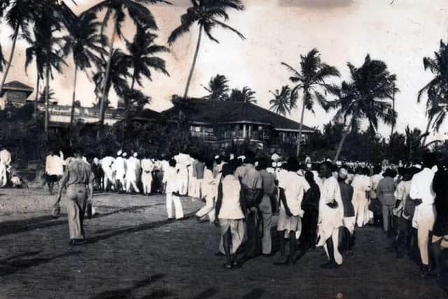 Crowds gather to meet Gandhi on Bombay beach, photographed by Josephs grandfather. EMN-210811-162001001