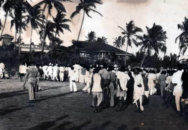 Crowds gather to meet Gandhi on Bombay beach, photographed by Josephs grandfather. EMN-210811-162001001