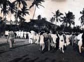 Crowds gather to meet Gandhi on Bombay beach, photographed by Josephs grandfather. EMN-210811-162001001