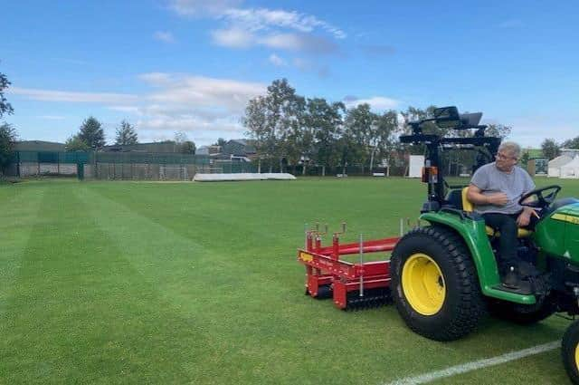 Market Rasen Town Football Club volunteer groundsman Kevin Bett using some of the new equipment to enable the players to enjoy better playing surfaces at Rase Park for the next few years. EMN-210911-090258001