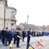 The standard bearers lower their flags at 11am. EMN-211115-092151001