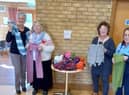 Leasingham WI pose with their scarves.