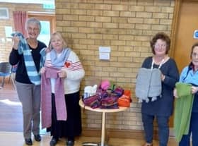 Leasingham WI pose with their scarves.