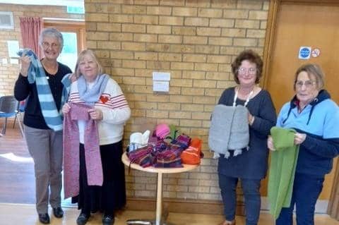 Leasingham WI pose with their scarves.