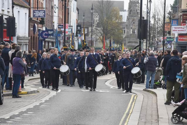 The Remembrance Sunday parade heads up Southgate in Sleaford. EMN-211115-103503001