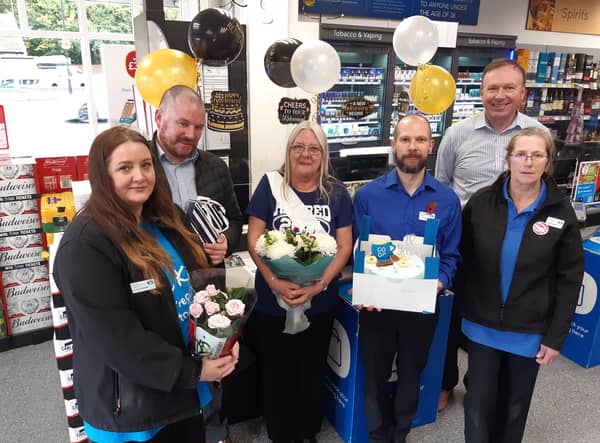 Sandra Taylor (centre)s last day at Co-op, from left: Sheryle Hay, Co-op regional manager Phil Waddington, store manager Adam Waddingham and general manager Craig Adamson. EMN-211011-121920001