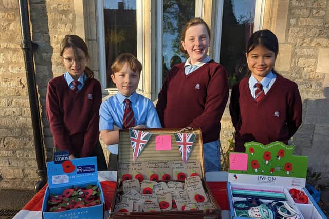 William Alvey School year six pupils with their poppy appeal stall. EMN-211111-175817001