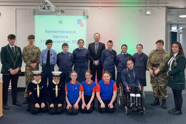 Skegness Grammar students who are members of local cadets services wore their uniforms for the Armistice Day ceremony held at school. They are (from left, back to front) - Tom Capes Head Boy, William Read, Jack Parish, Kieran Tempest, Emilia Watson, Jude Hunton – Headmaster, Luca Burke, Ava Ladlow, Carmel Burke, Chloe Smith, Evee Atkin-Pagent – Head Girl, Marisa Truszkiewicz,
Jaylea Nowicki, Vienna Page, Lottie Rook, Isabelle Balckmore, and Casey Burke,