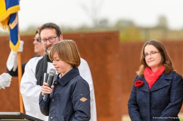 Toby, of Navenby School, reading out his winning poetry entry at the IBCC Remembrance Service. Photo: David Harrison EMN-211111-172433001