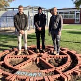 Builders Luke Pilkington, Carl Jupp and Charlie Matthews creating the Rotary Wheel.