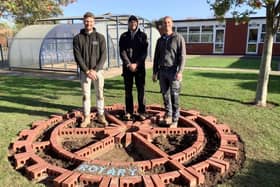 Builders Luke Pilkington, Carl Jupp and Charlie Matthews creating the Rotary Wheel.
