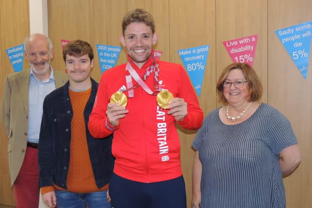 Paralympic double gold medallist Ben Watson is welcomed as charity champion by, from left - GAIN chairman Chris Fuller, patient liaison Simon Johnson and chief executive Caroline Morrice. EMN-211211-180826001
