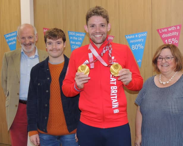 Paralympic double gold medallist Ben Watson is welcomed as charity champion by, from left -  GAIN chairman Chris Fuller, patient liaison Simon Johnson and chief executive Caroline Morrice. EMN-211211-180826001