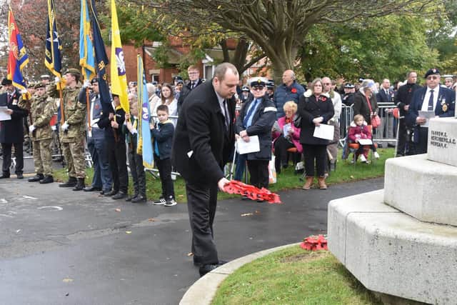 Coun Carl Macey lays a wreath on behalf of Lincolnshire County Council. Photo: Barry Robinson.