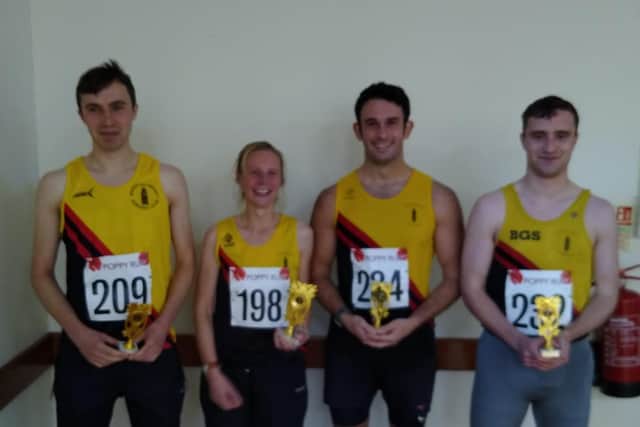The winning men's team and Emma Penson.